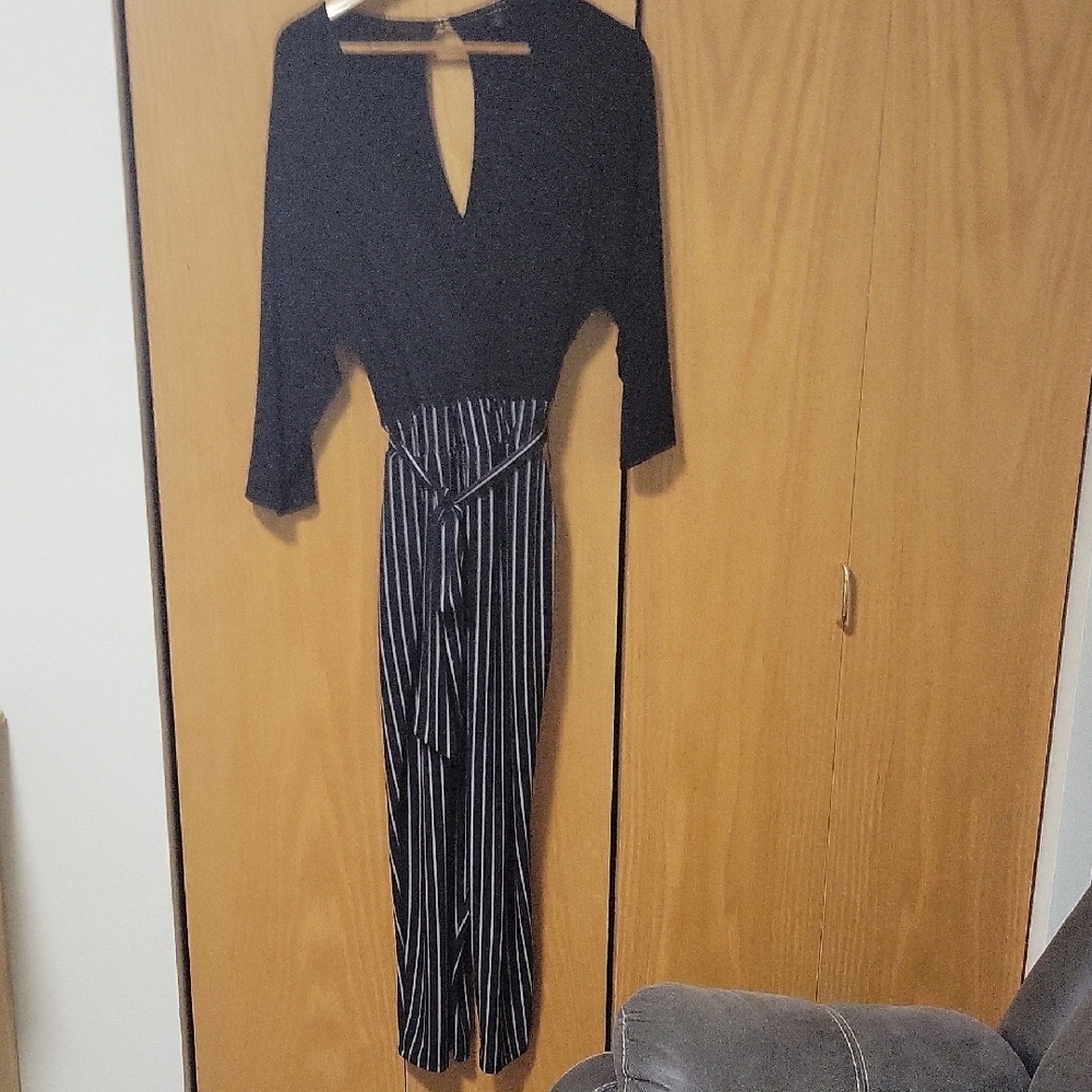 Torrid Black and White Striped Jumpsuit with Keyhole Detail